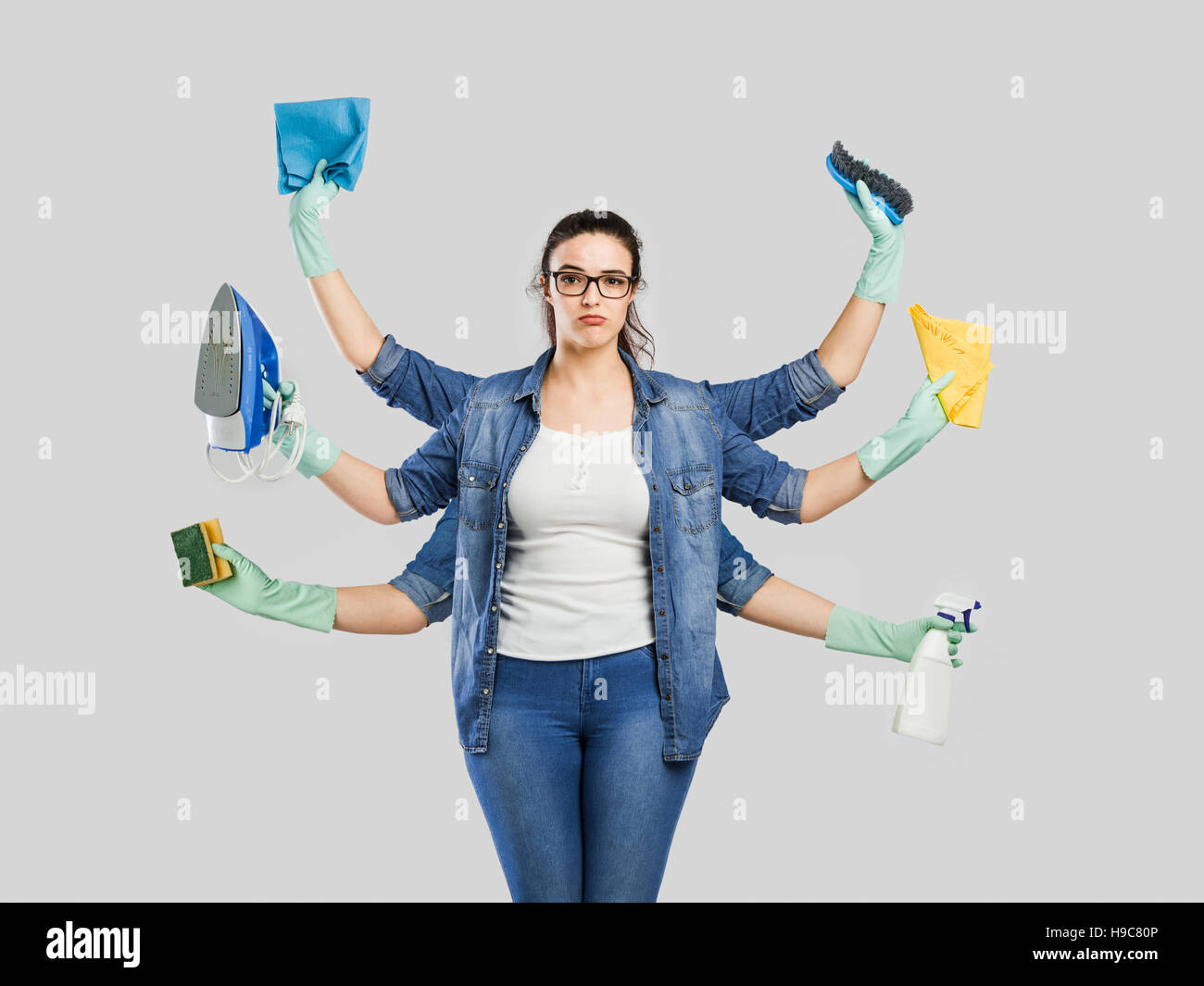 Creative concepts of a housewife with six armr Stock Photo