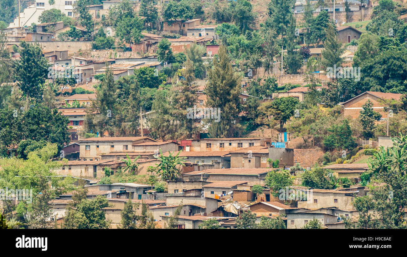 Houses of Kigali stacked on on top of the other along the hilly landscape of the city Stock Photo