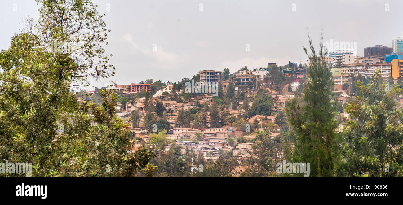 Houses of Kigali stacked on on top of the other along the hilly landscape of the city Stock Photo