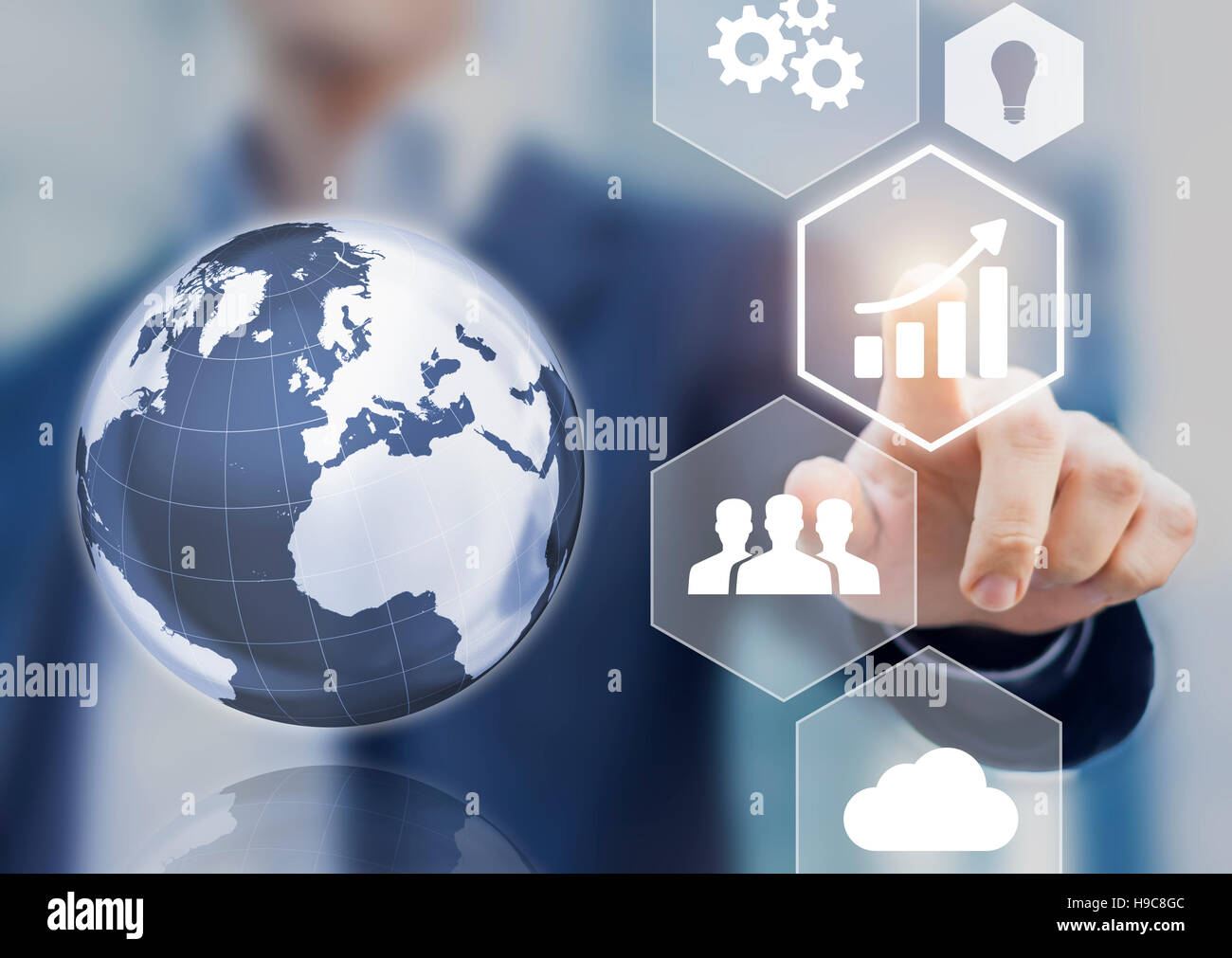 Abstract concept of business success, growth and globalization, businessman touching growing graph and 3d earth globe Stock Photo