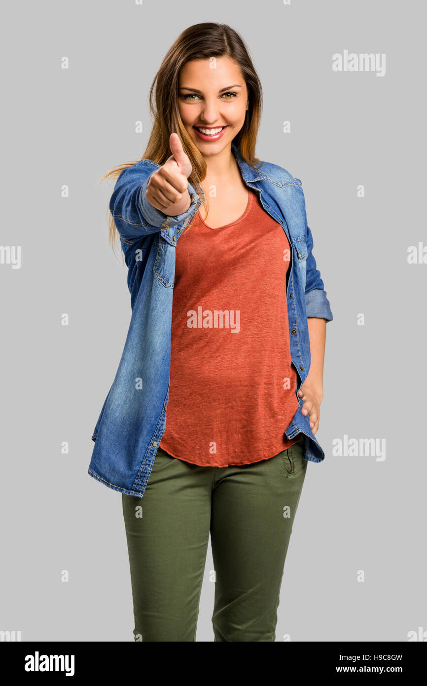 Beautiful and happy woman with thumbs up Stock Photo - Alamy