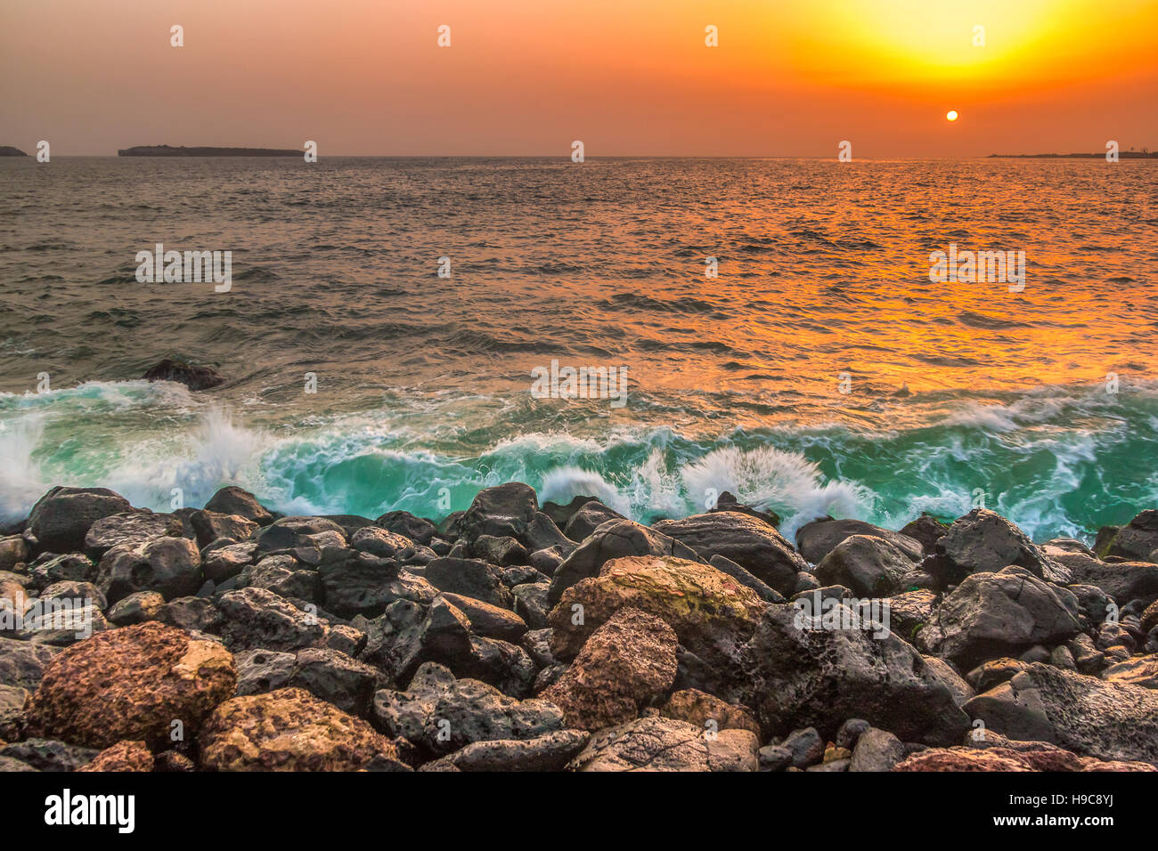 The beautiful waters of the Atlantic ocean with its rocky coastline near the City of Dakar in Senegal Stock Photo