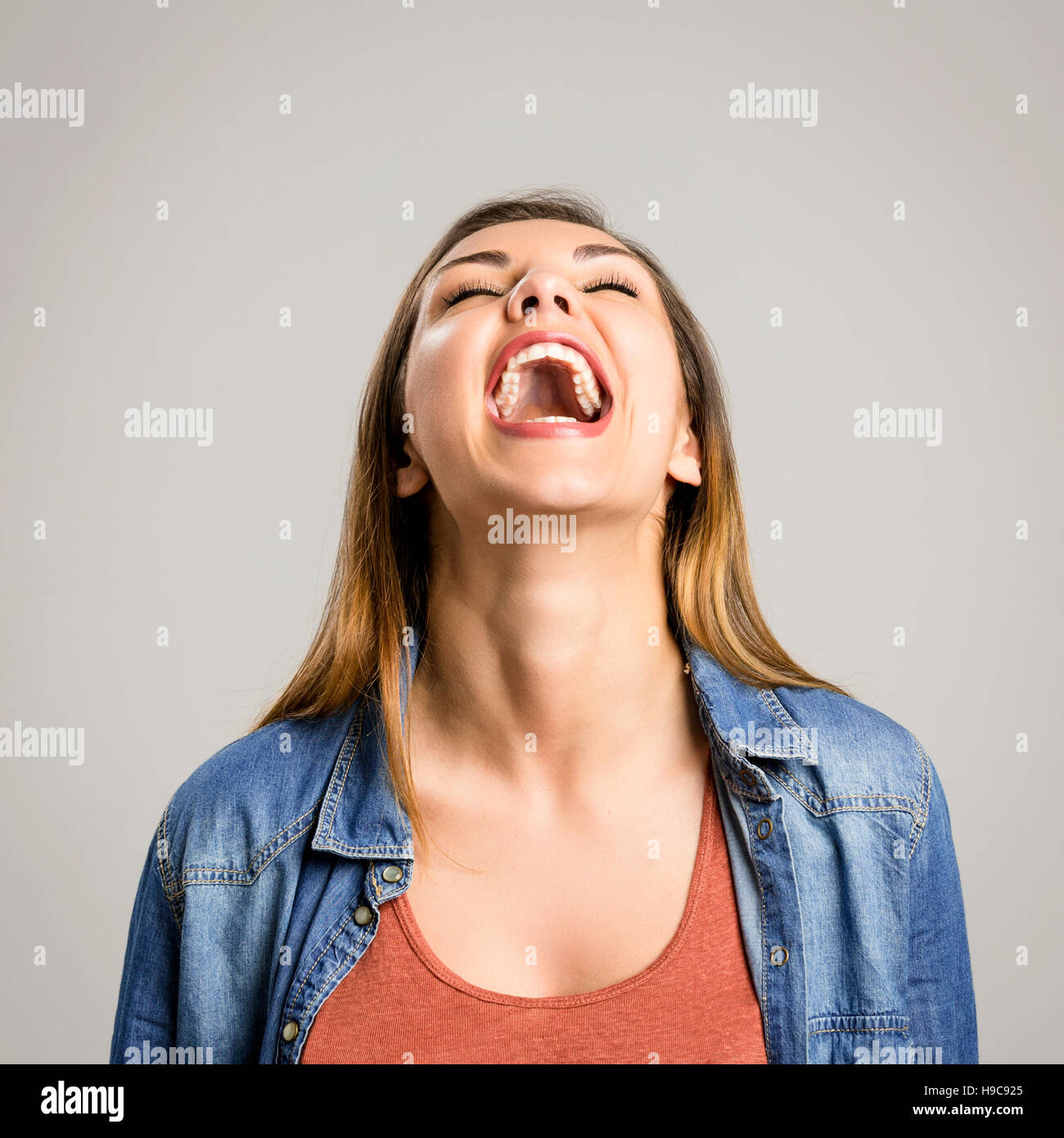 Portrait of a beautiful and happy woman laughing Stock Photo
