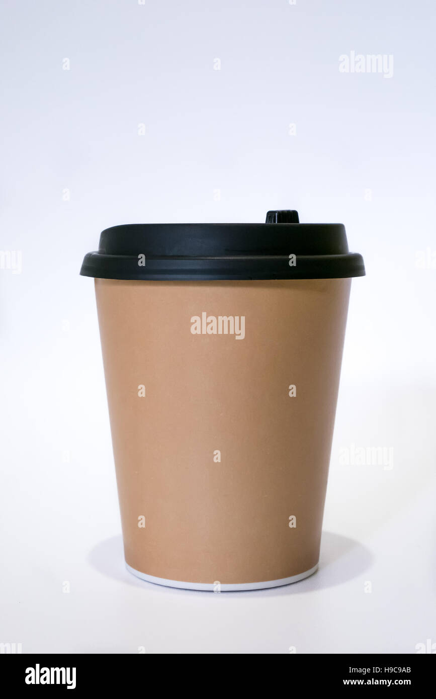 The brown paper cup of hot coffee with black cap Stock Photo - Alamy