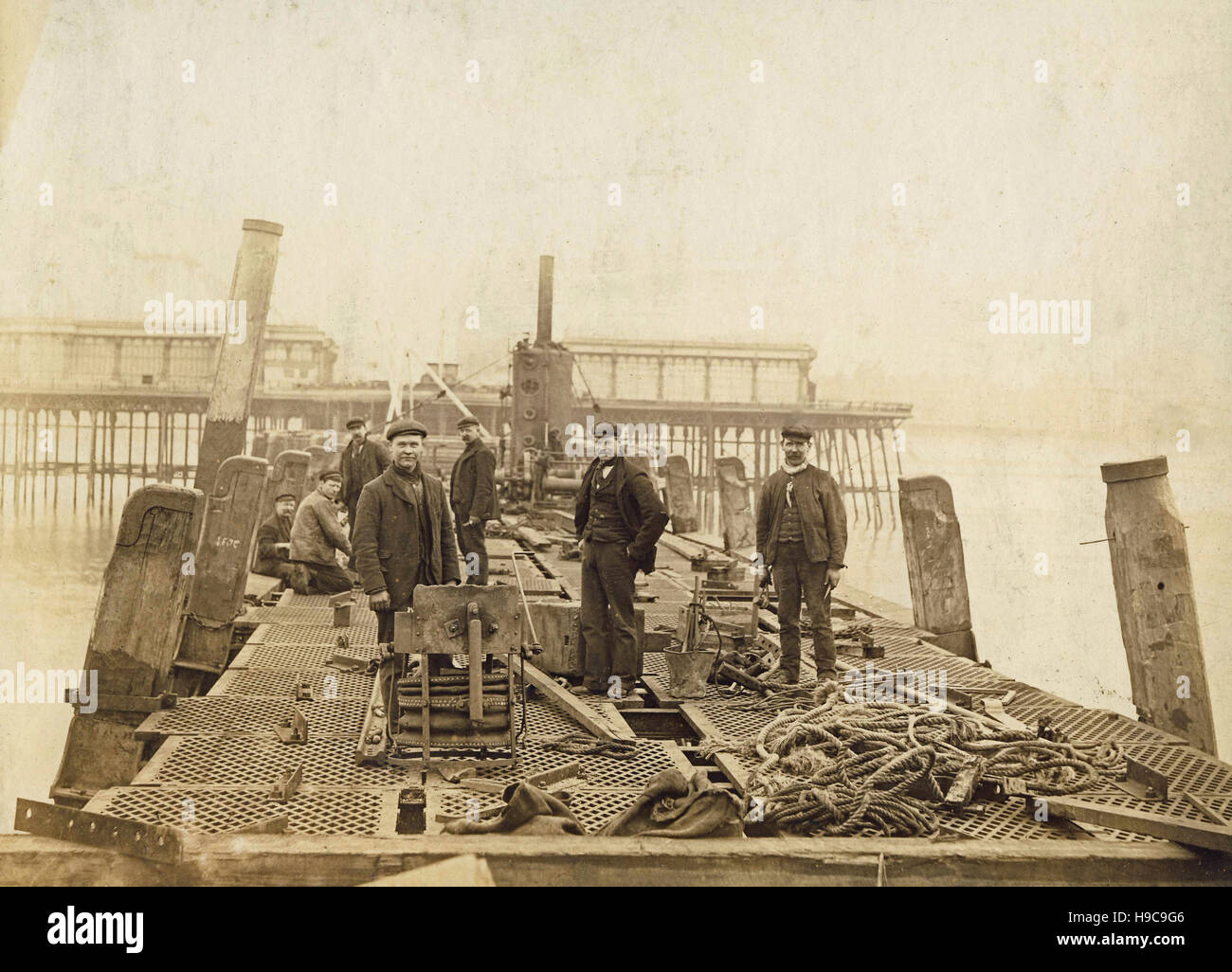 Historic archive image of construction workers on Pier at Blackpool c1900s.  Later handwritten caption reads 'Building the North Pier, Blackpool. Stock Photo