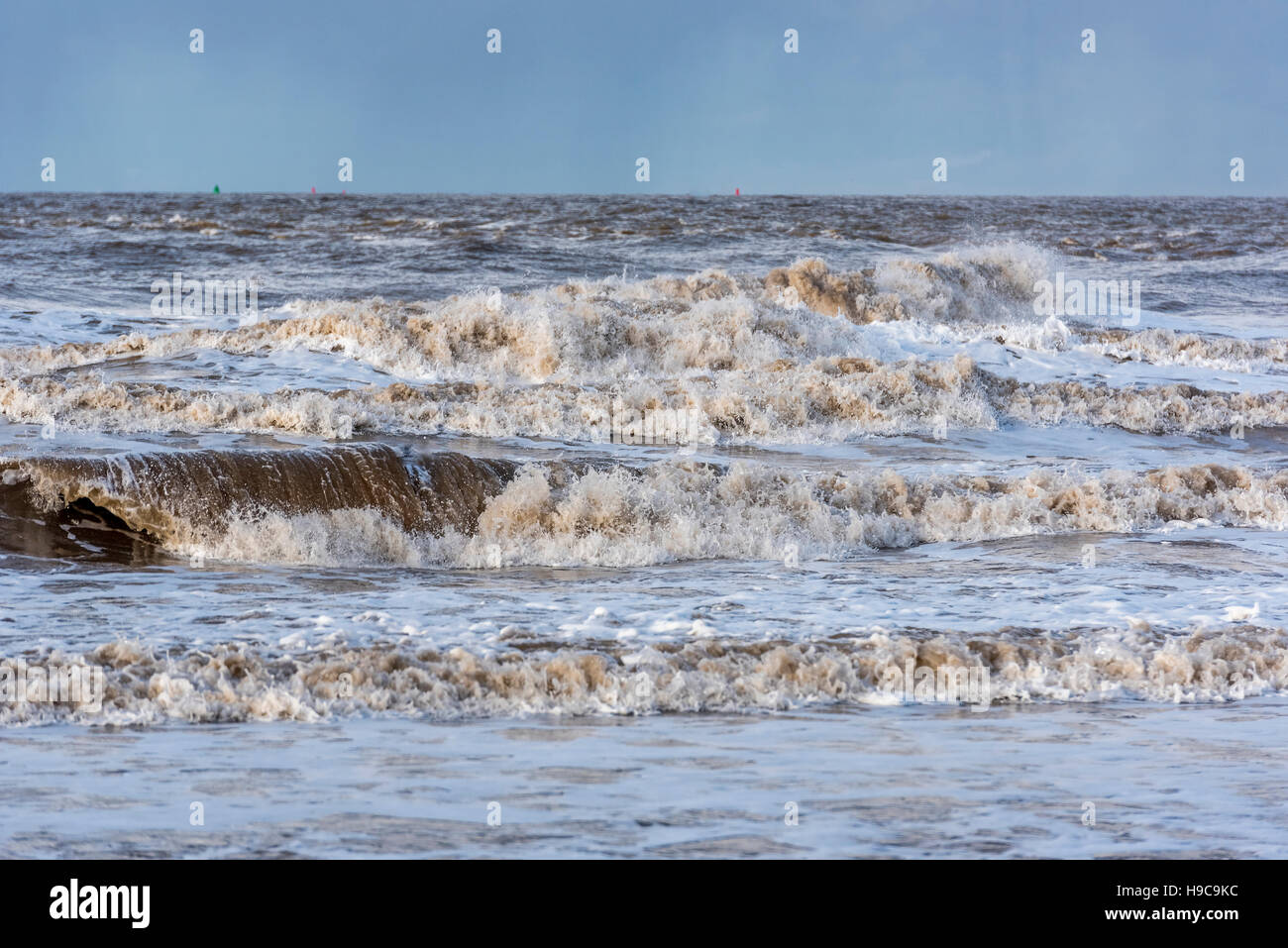Stormy river Mersey waves crash on the beach at New Brighton. Wirral Merseyside. North West England Stock Photo