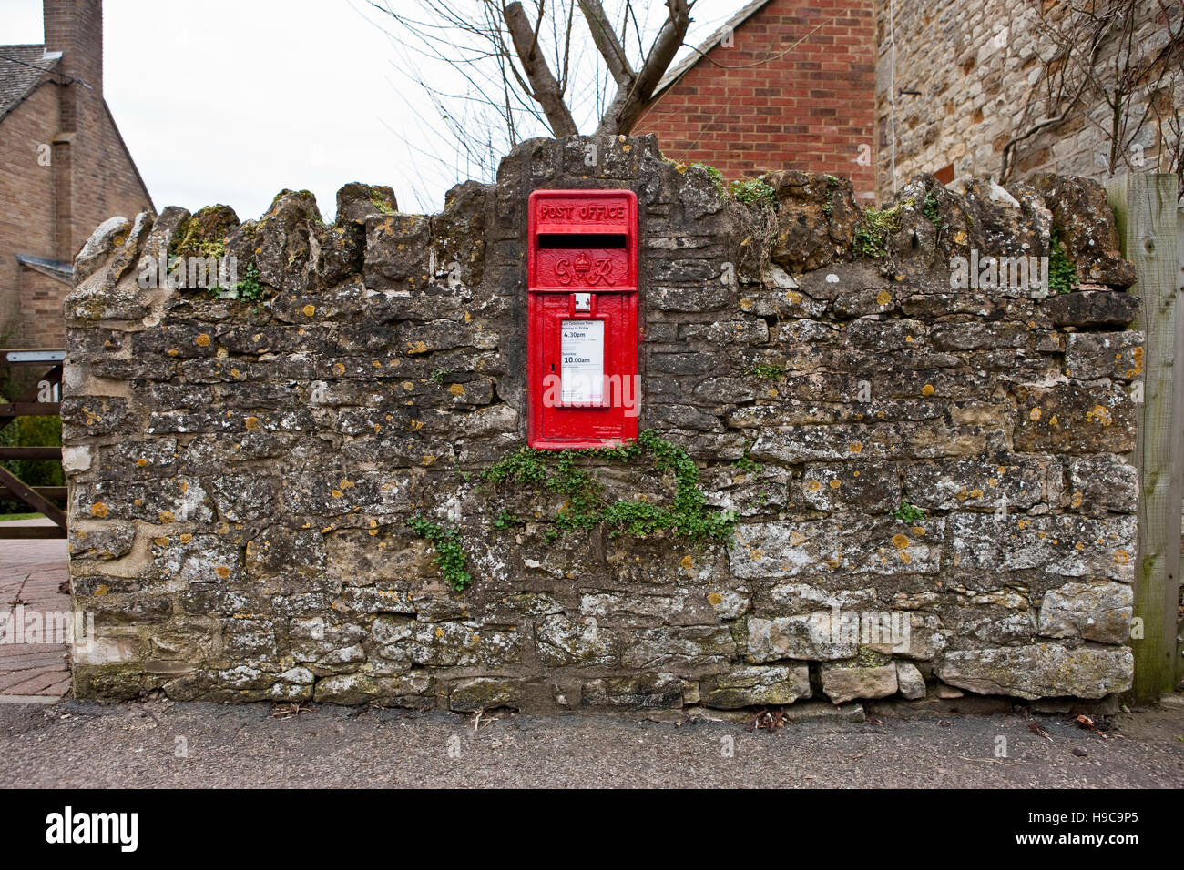 A post box in a brick wall in Harrington, Northamptonshire Stock Photo -  Alamy