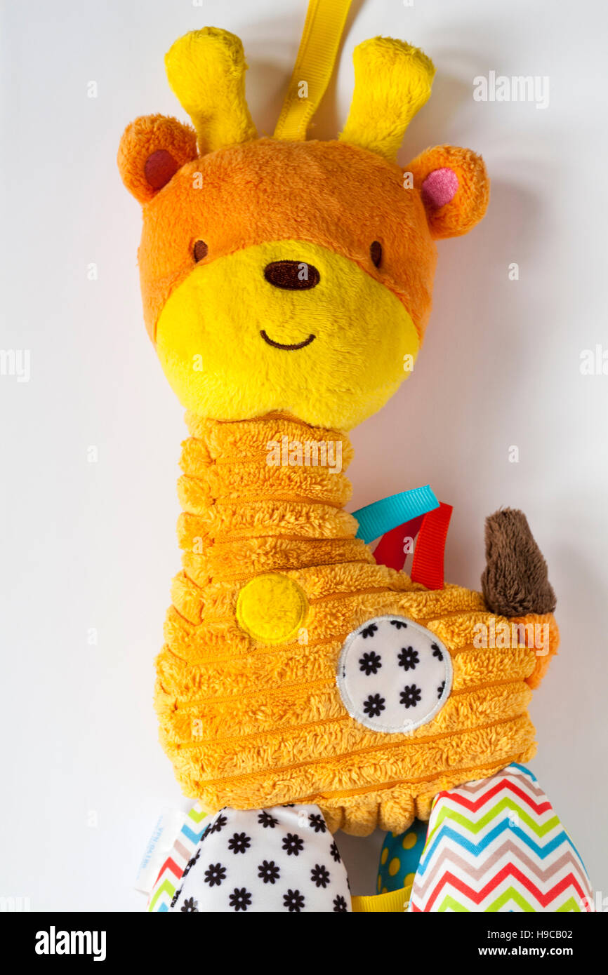 Carousel giraffe soft cuddly toy set on white background Stock Photo