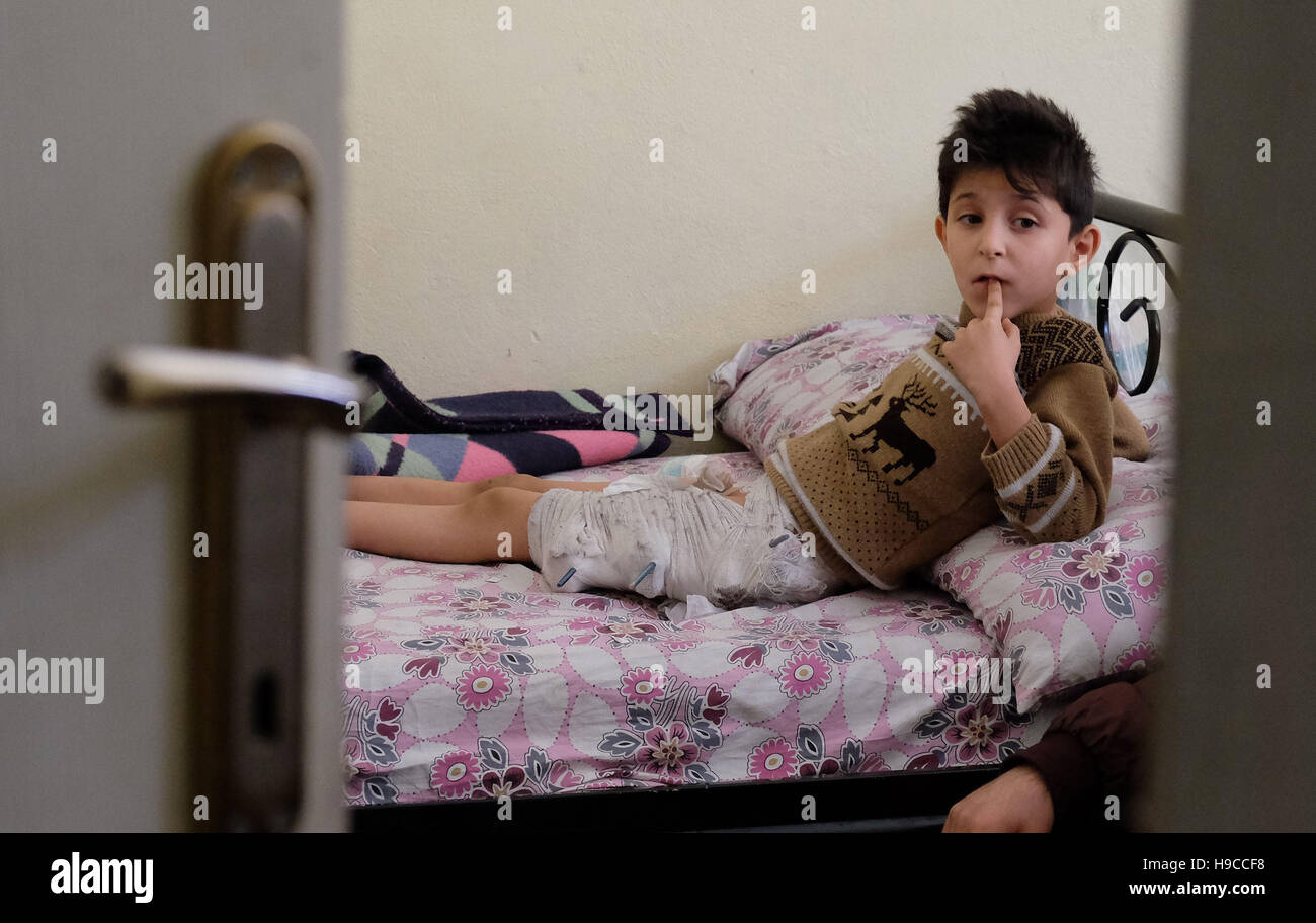 Syrian refugee Abdulaziz Salamah, 8, undergoing treatment at a physical rehabilitation centre in Sanliurfa, south eastern Turkey, run by the UK-based charity Muntada Aid in partnership with AID Turkey. Abdulaziz was badly injured when a missile hit his home in Deir Ezzor a year ago, killing his grandmother and leaving him with a piece of metal stuck in his back which a local hospital was unable to remove. His father had died three years earlier, and his mother left him and his sister alone after the attack. Abdulaziz' uncle brought the children to live with an aunt in Turkey, where he Stock Photo