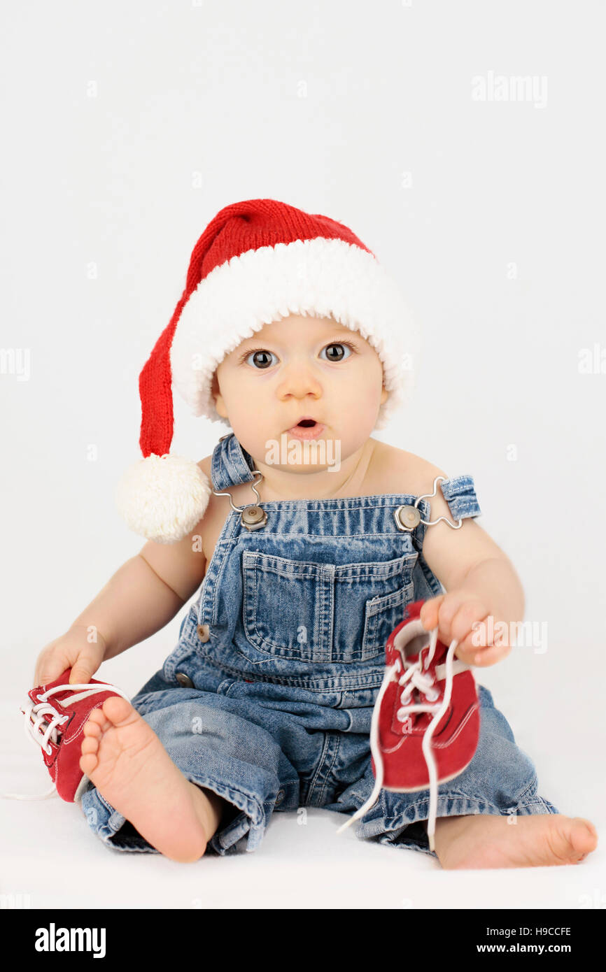 Baby Santa Clause getting ready for Christmas Stock Photo