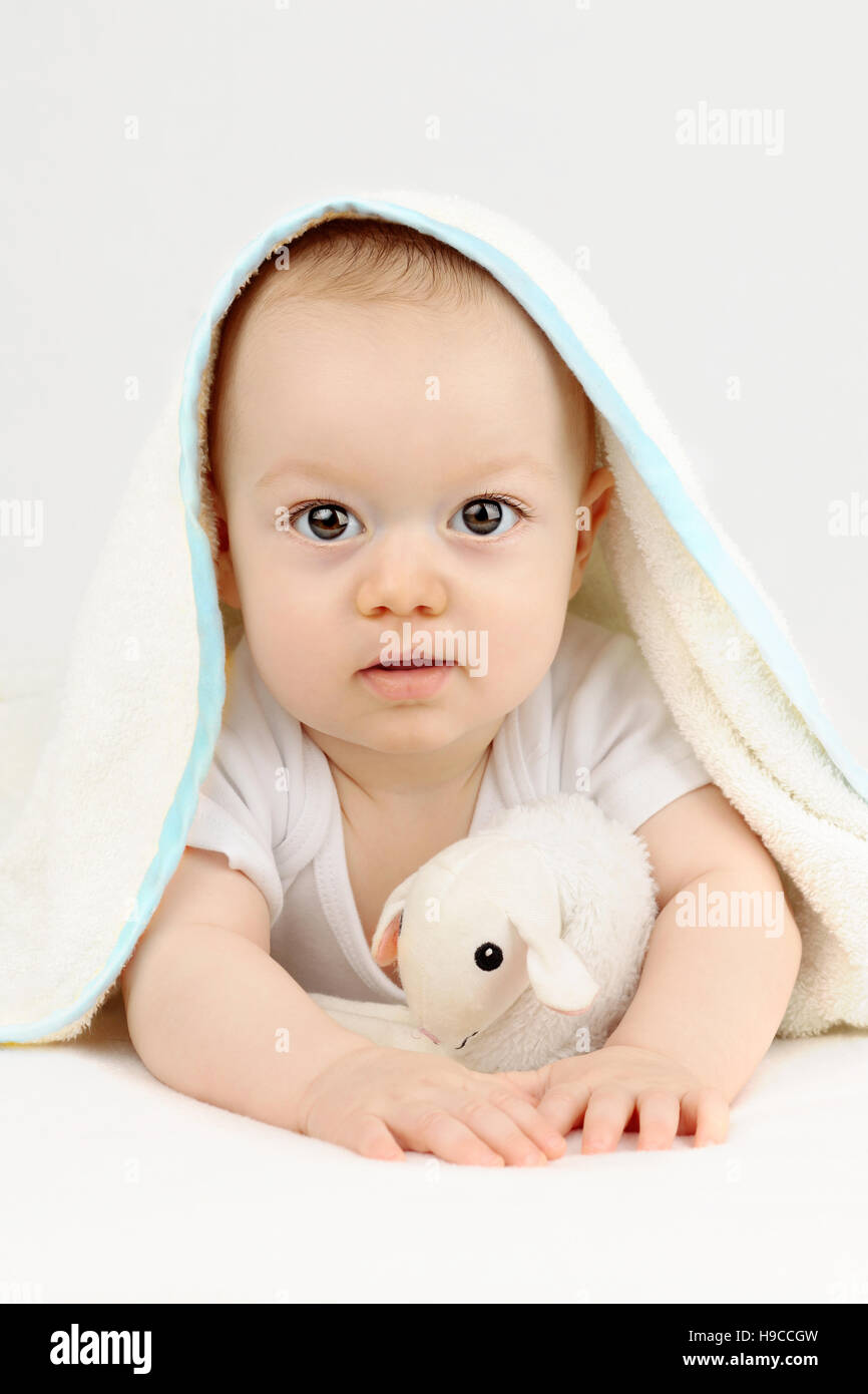Baby boy after his bath under a towel Stock Photo Alamy