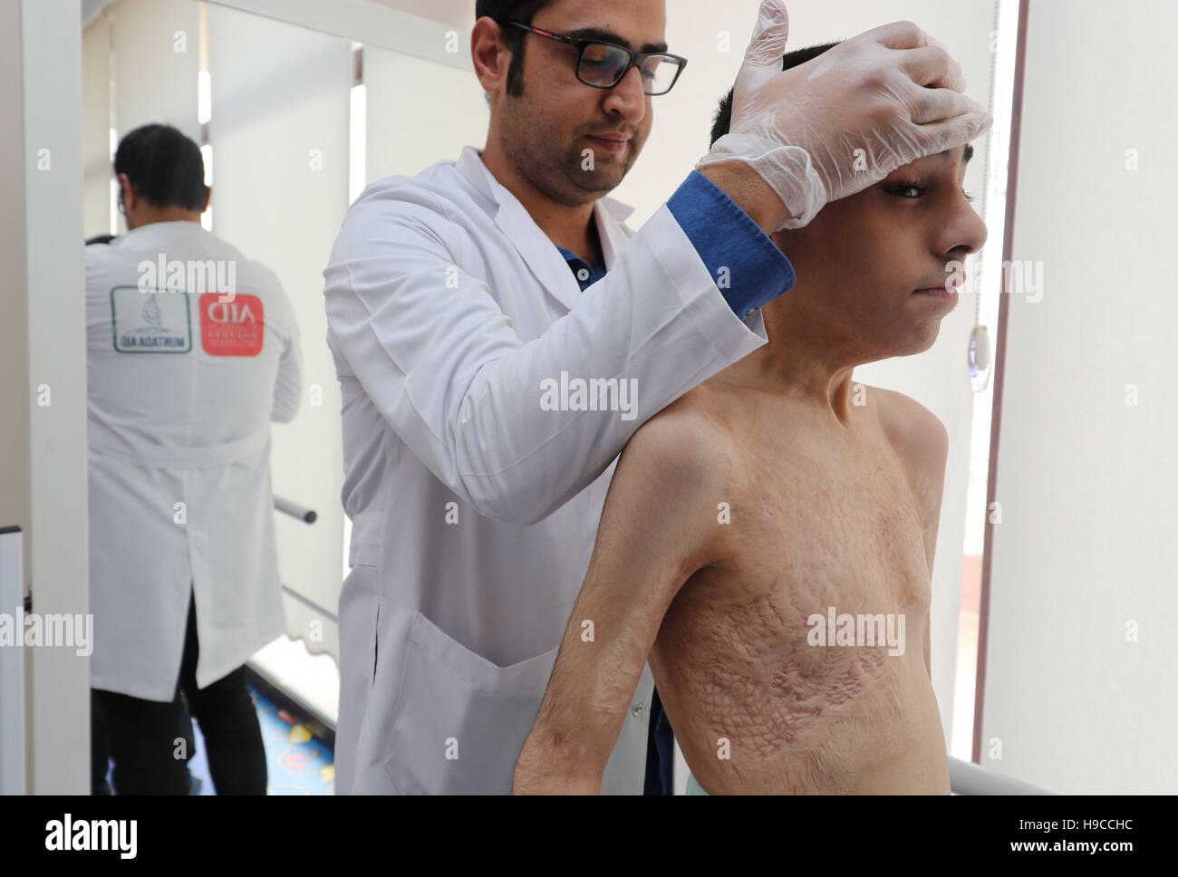 Syrian refugee Ahmad El Alayi, 12, undergoing treatment at a physical rehabilitation centre in Sanliurfa, south eastern Turkey, run by the UK-based charity Muntada Aid in partnership with AID Turkey. Ahmad fled Syria after his home was bombed two years ago, killing the whole family except for him and his grandfather. Ahmad was badly burnt in the bombing and lost most of his cognitive abilities. He is now unable to speak or control his body, and suffers from post-traumatic stress disorder (PTSD). Stock Photo