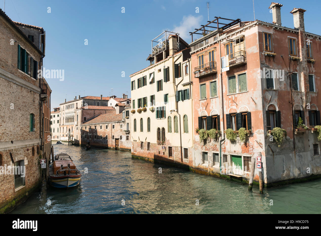 Canal with docked boats, Venice, Italy, Europe Stock Photo