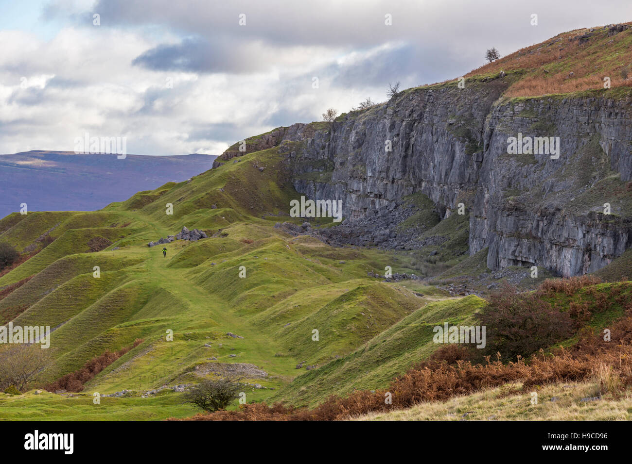 Llangatwg disused quarries and the distant Cafn Moel mountain near Llangattock, Brecon Beacons National Park, Wales, UK Stock Photo