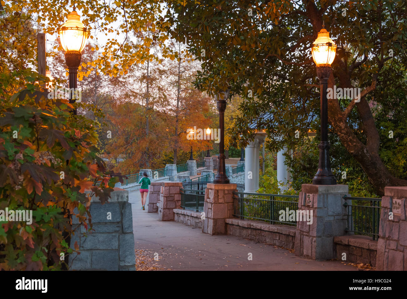 Woman jogging at Piedmont Park in Atlanta, Georgia. (USA) Stock Photo