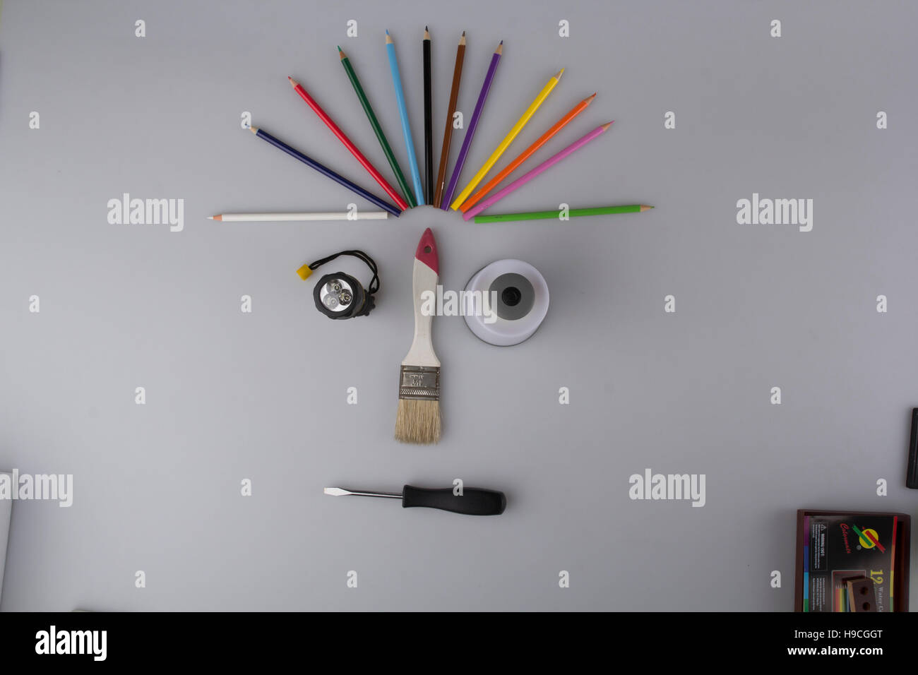https://c8.alamy.com/comp/H9CGGT/desk-of-an-artist-with-lots-stationery-objects-studio-shot-on-white-H9CGGT.jpg