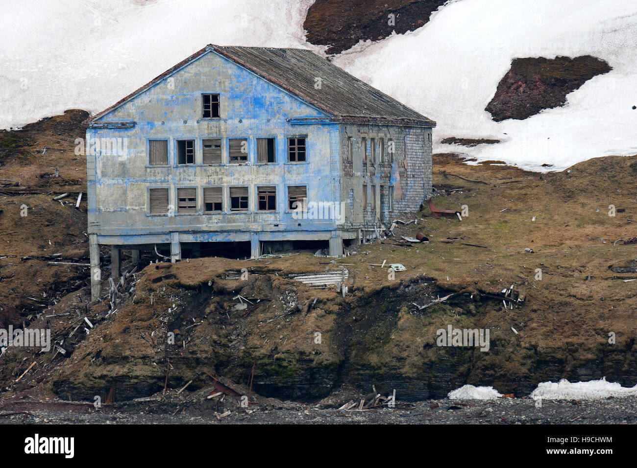 Dilapidated building of deserted Russian mining settlement in Svalbard, between Longyearbyen and Barentsburg, Isfjorden, Spitsbergen, Norway Stock Photo