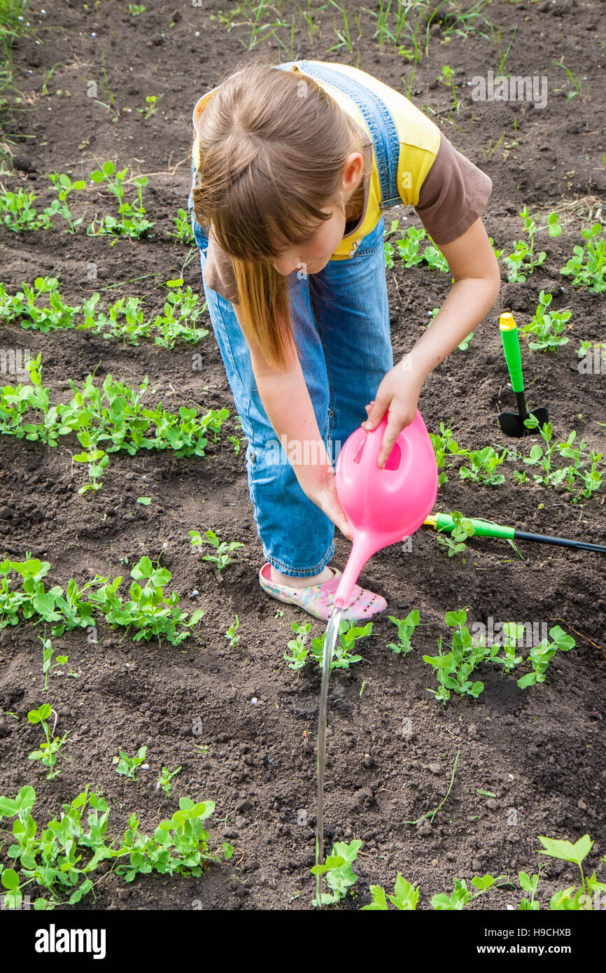 little girl in garden Stock Photo Alamy
