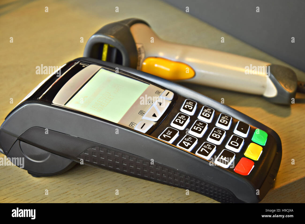 Bank terminal with hand reader of barcode Stock Photo - Alamy