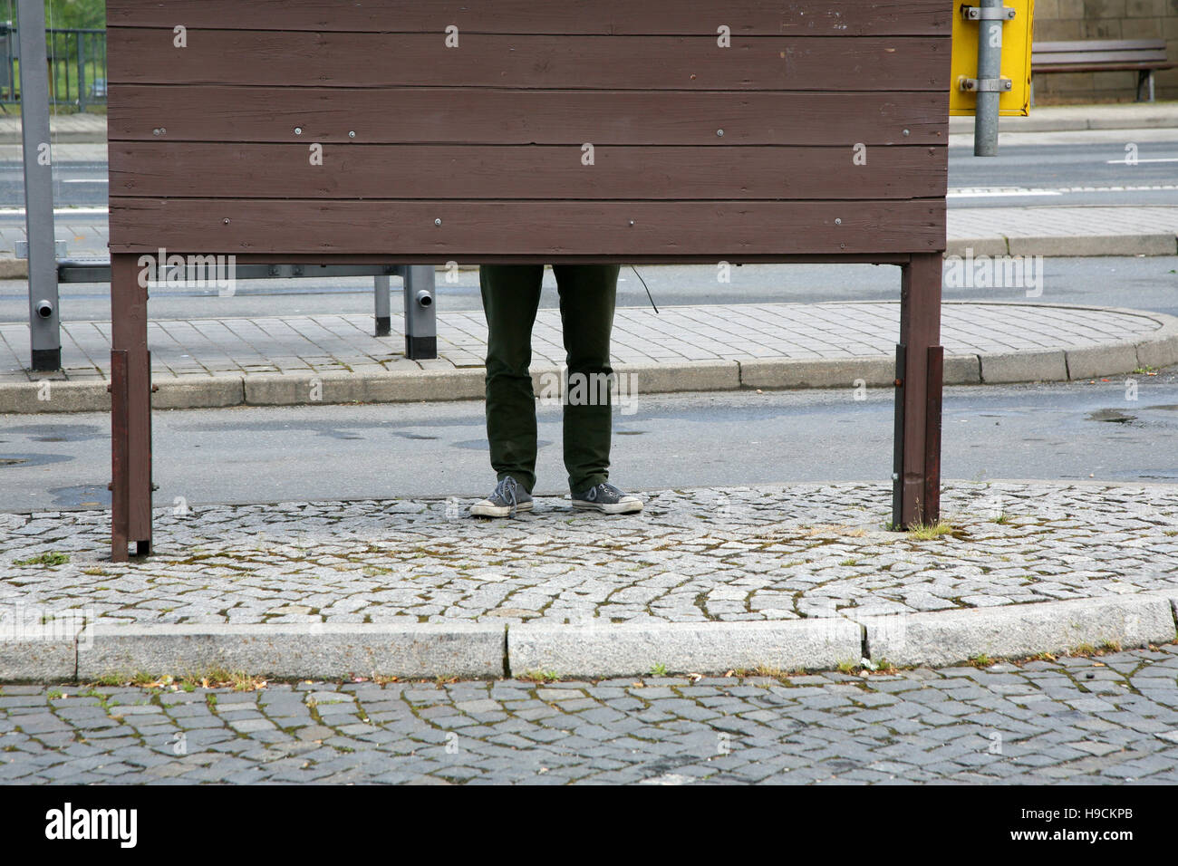 Legs Behind Board Stock Photo - Alamy