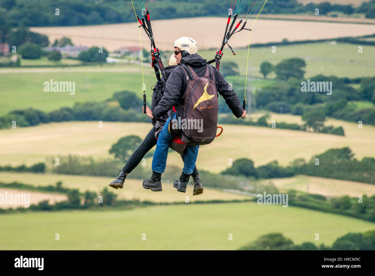 Parascender flying over the South Downs at Devil's Dyke Stock Photo