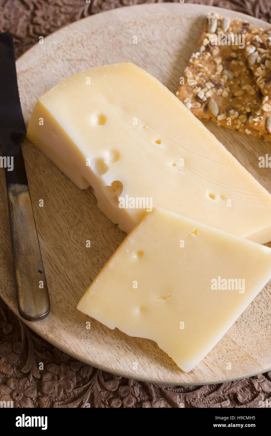 Jarlsberg a mild creamy Norwegian cheese similar to Swiss Emmental with