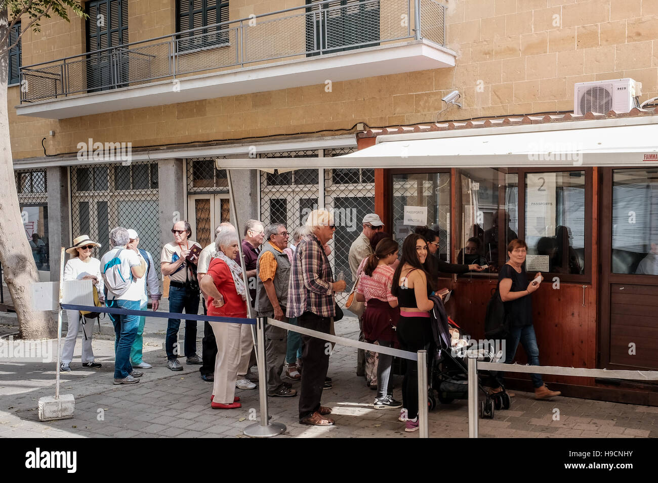 People queue at the border control between the Greek Cypriot and Turkish Cypriot areas in Nicosia, Cyprus. Stock Photo