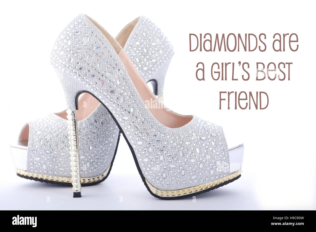 High heel rhinestone stiletto shoes with funny saying, Diamonds Are a Girls Best Friend. Stock Photo