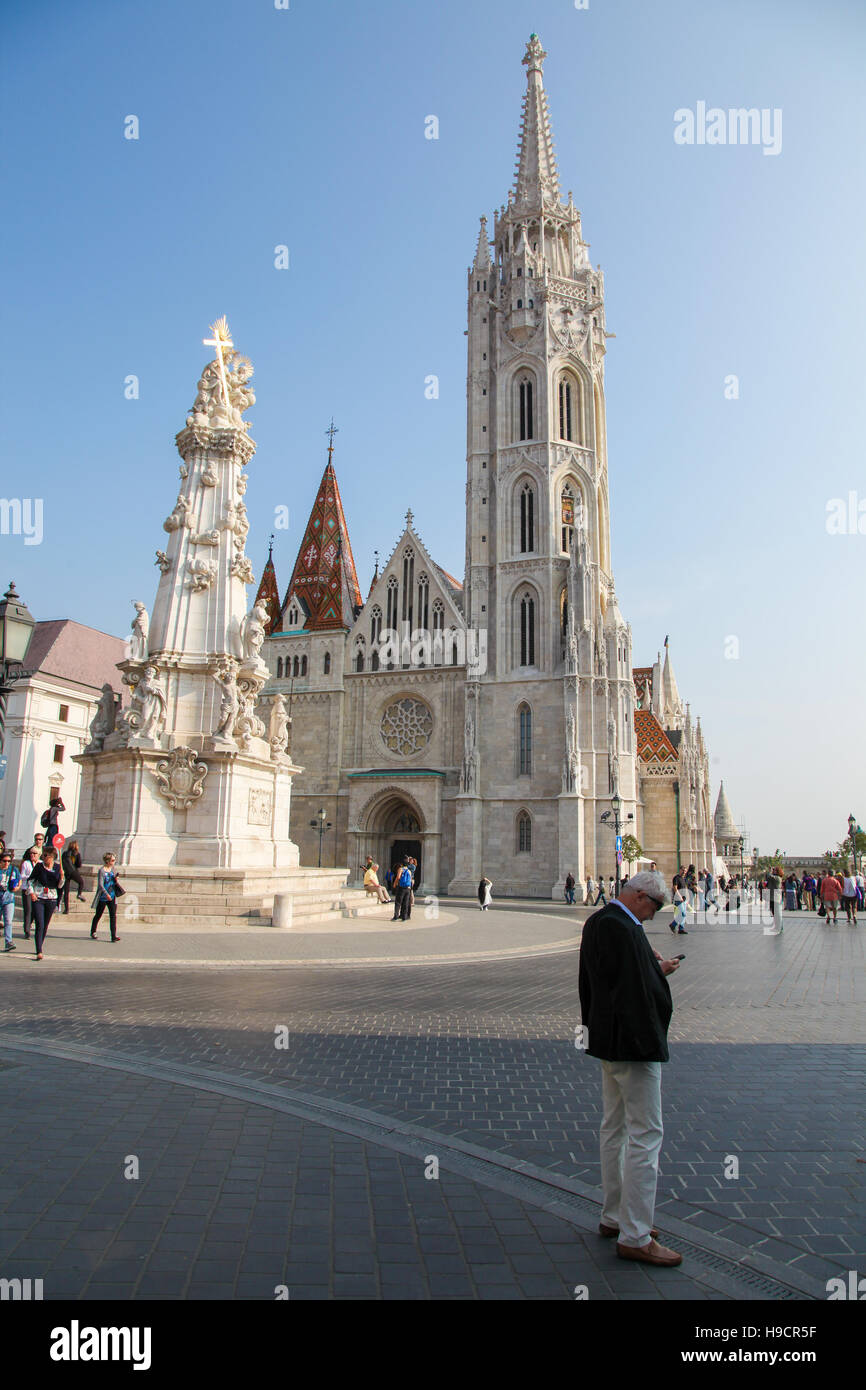 Matthias Church and Holy Trinity Column in Budapest, Hungary, at the heart of Buda's Castle District Stock Photo