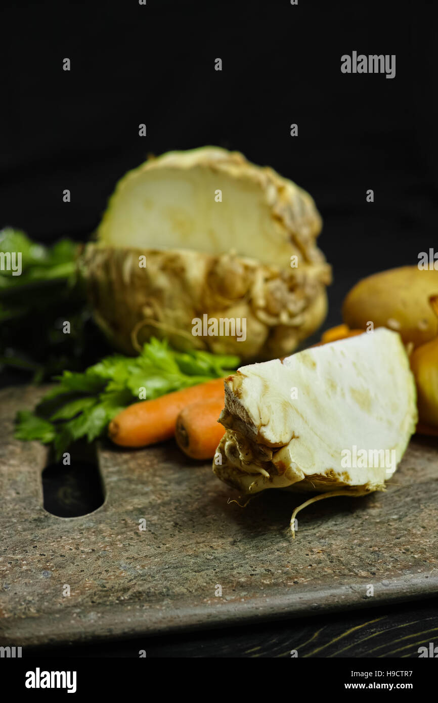 Ingredients for celeriac soup - celery root - celeriac, carrots, onion, potatoes - healthy diet concept Stock Photo