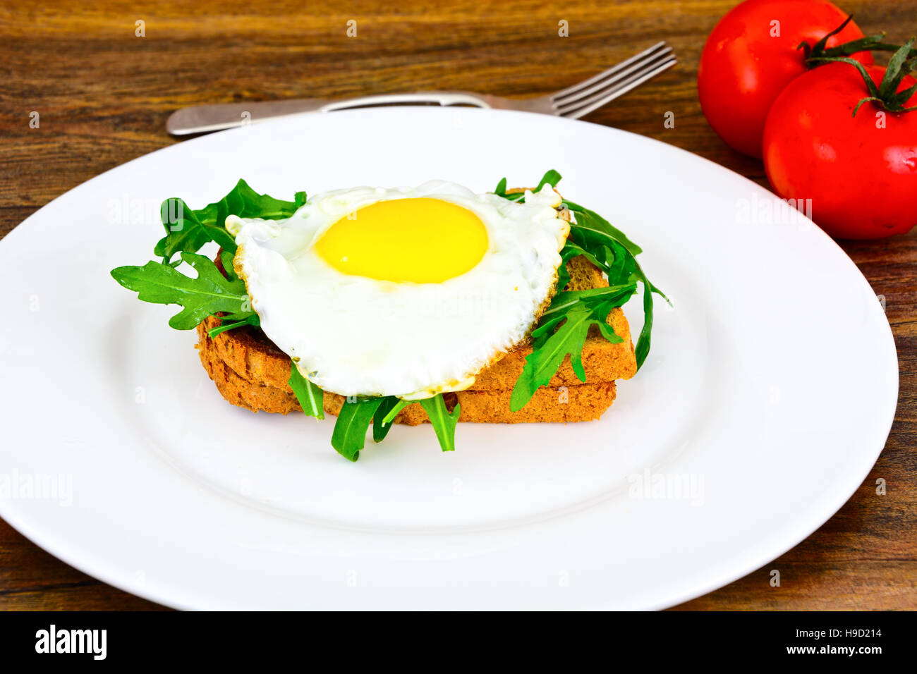 Scrambled Eggs with Arugula on Whole Grain Bread Health Food Stock