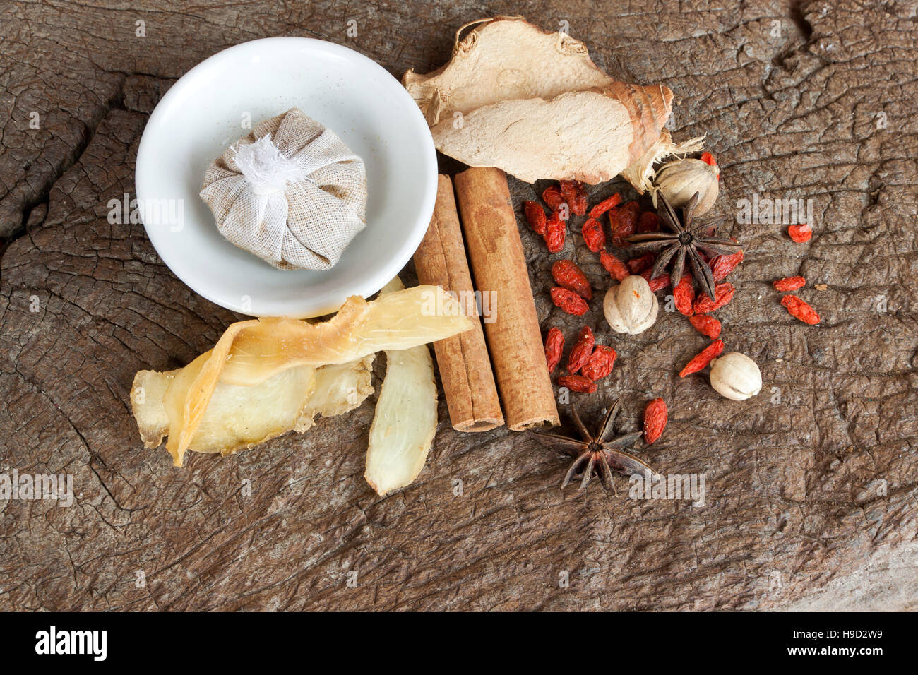 Spices chinese food and herbal wrap for stewed on old wood background