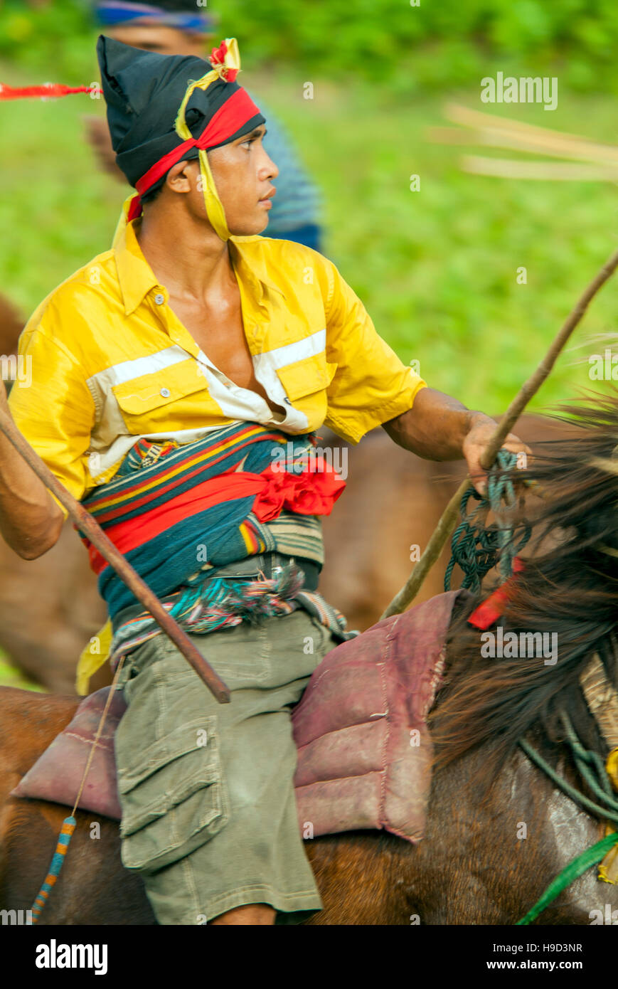 Horsemen at the Pasola, an annual battle where tribes throw spears to