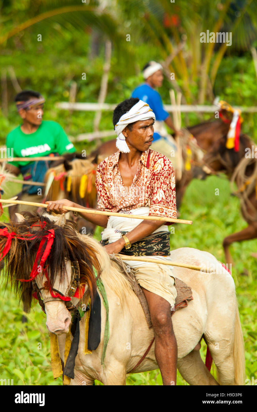 Horsemen at the Pasola, an annual battle where tribes throw spears to