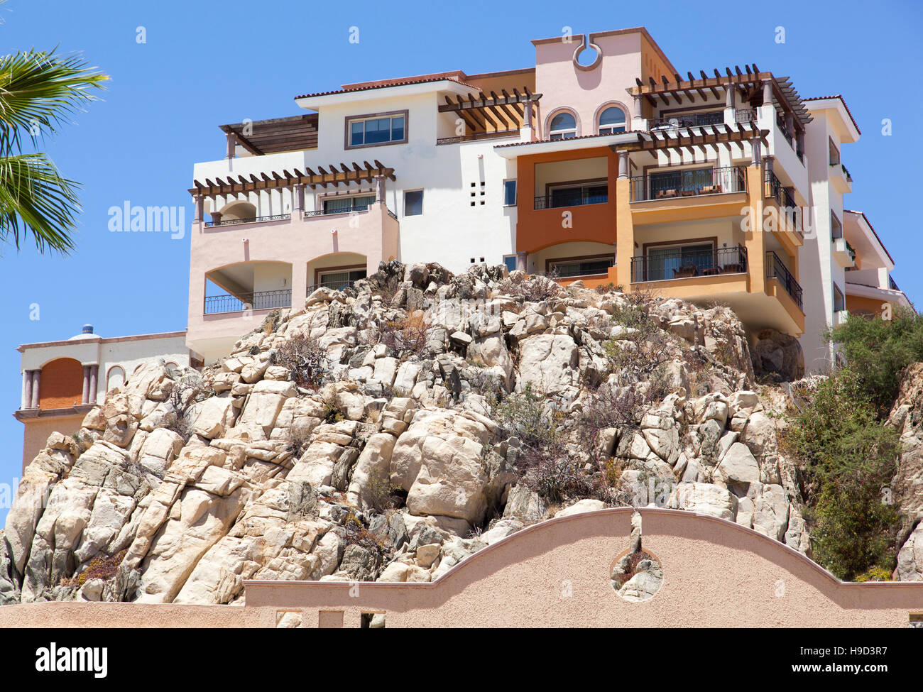 The house built on a cliff in Cabo San Lucas resort town (Mexico Stock