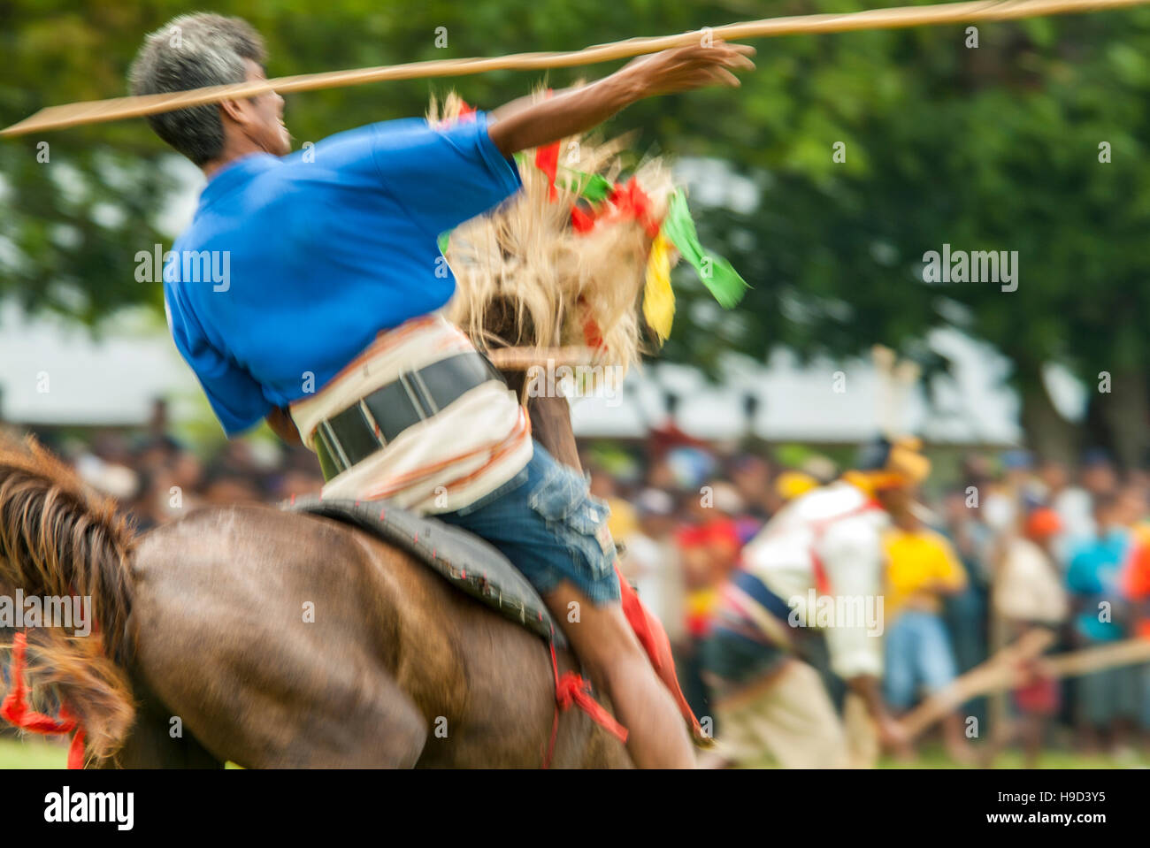 Horsemen at the Pasola, an annual battle where tribes throw spears to