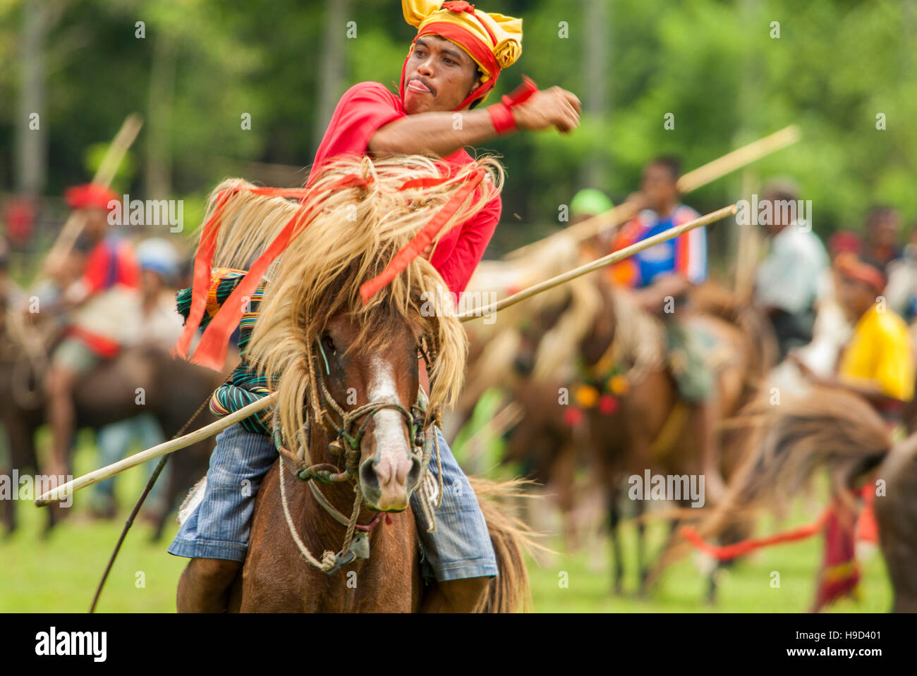 Horsemen at the Pasola, an annual battle where tribes throw spears to