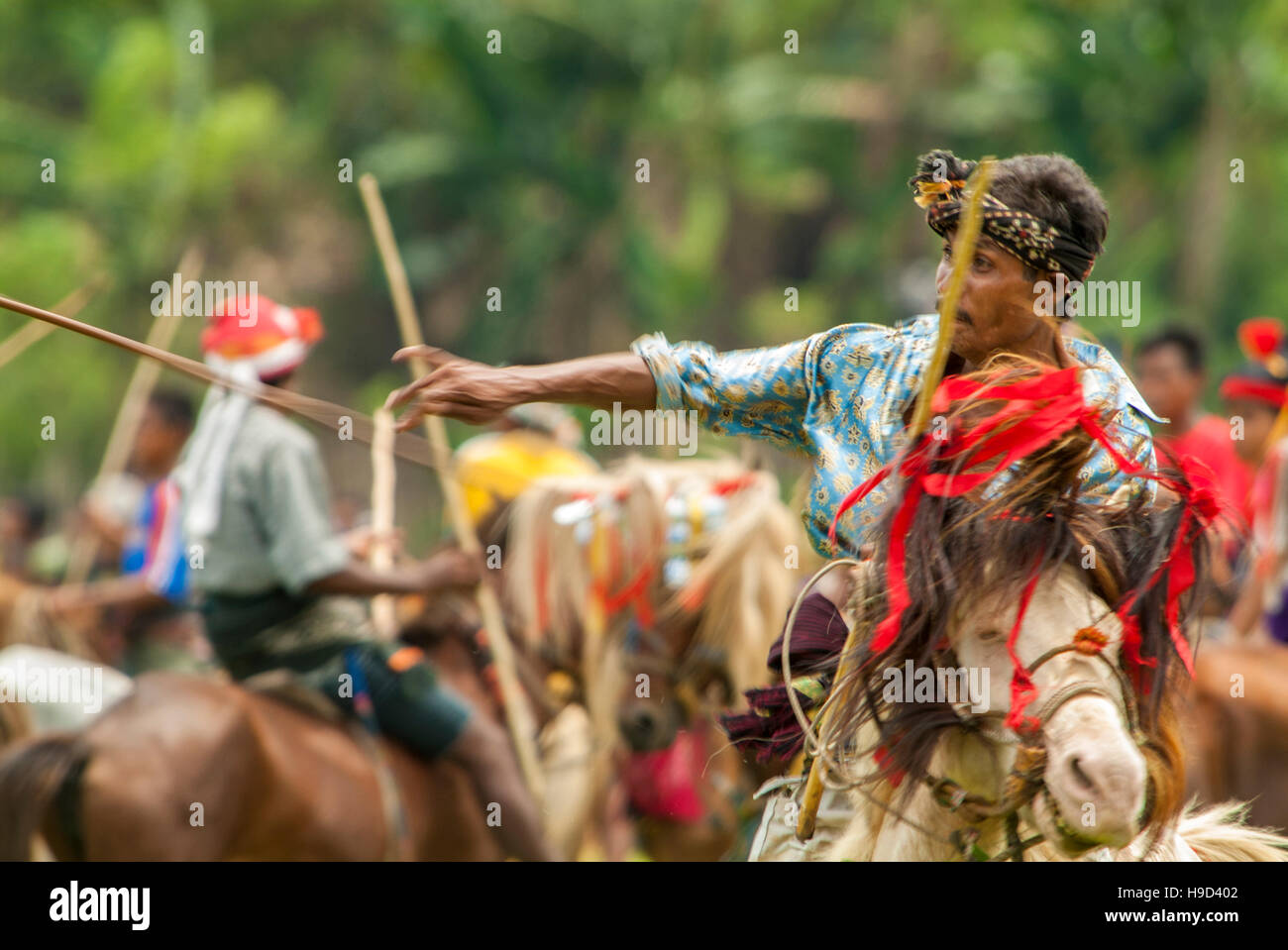 Horsemen at the Pasola, an annual battle where tribes throw spears to