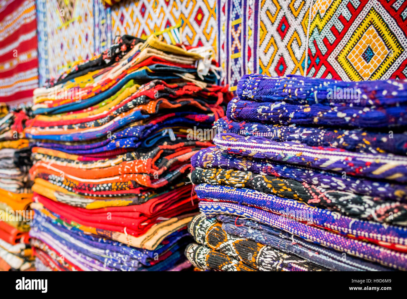 Colourful dyed rugs for sale in the souk, Marrakesh, Morocco Stock Photo