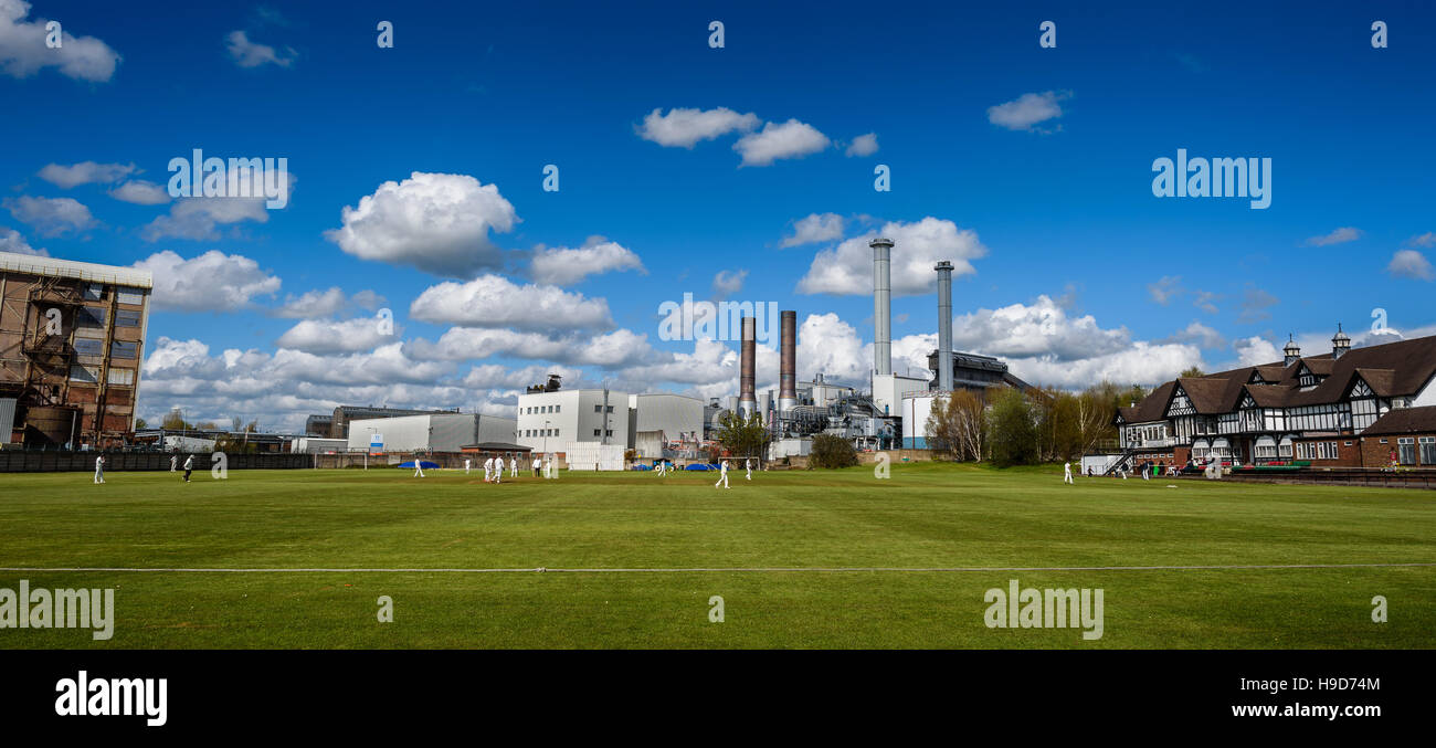 Cricket team playing at Winnington Park, Northwich recreation club against a backdrop *EDITORIAL* Stock Photo