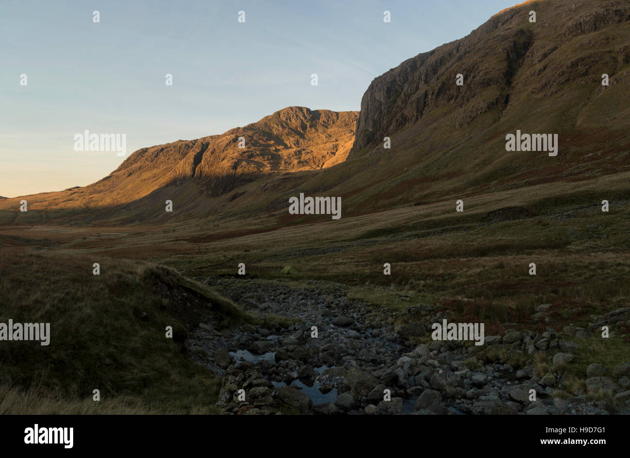 Solo Wild camp below Scafell Pike on Great Moss, pitched near the entrance ot Little Narrocove in The Lake District. Stock Photo