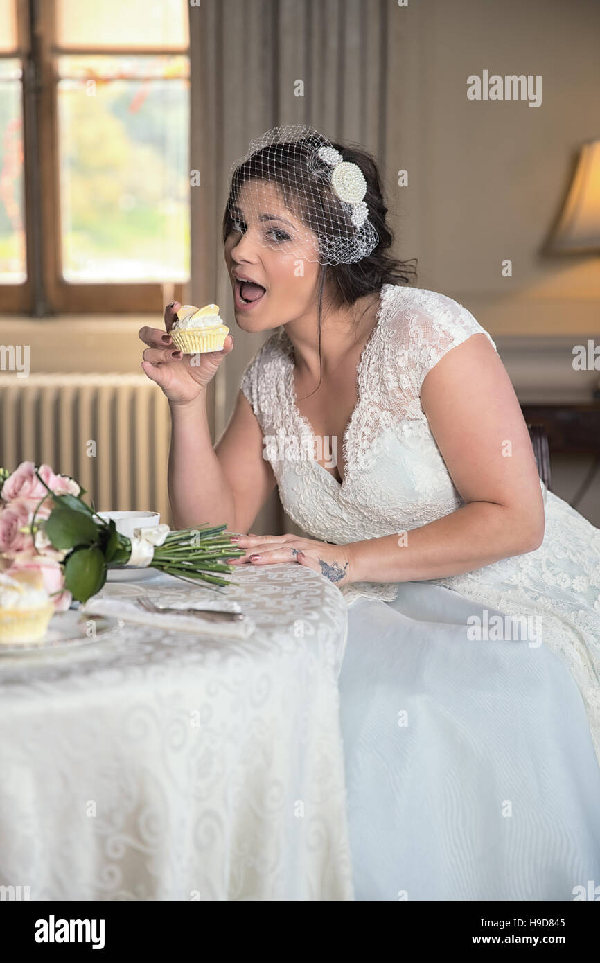 Naughty bride teases as if about to eat ...