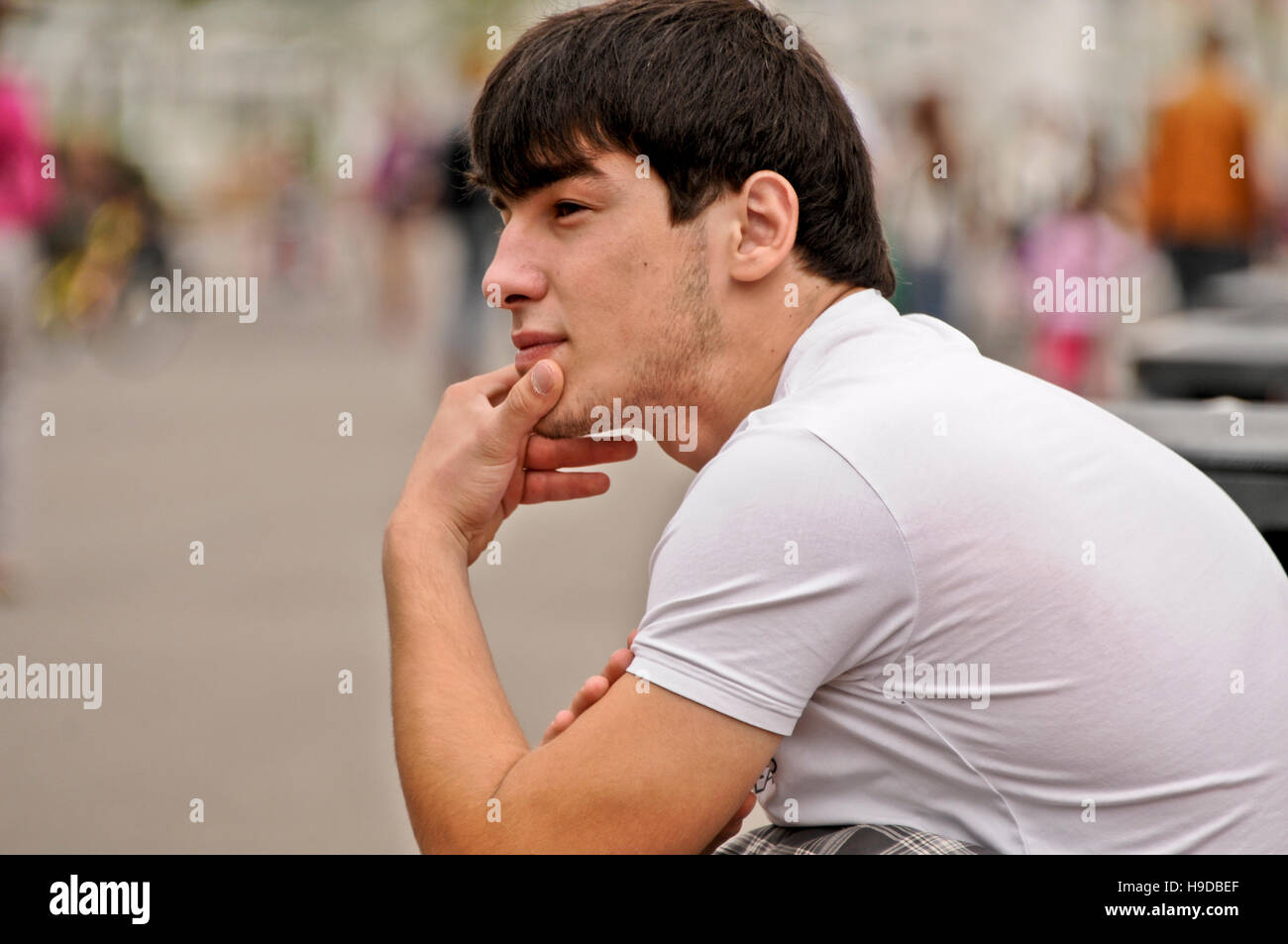Portrait of a dark haired young Russian man, Gorky Park, Moscow, Russia Stock Photo