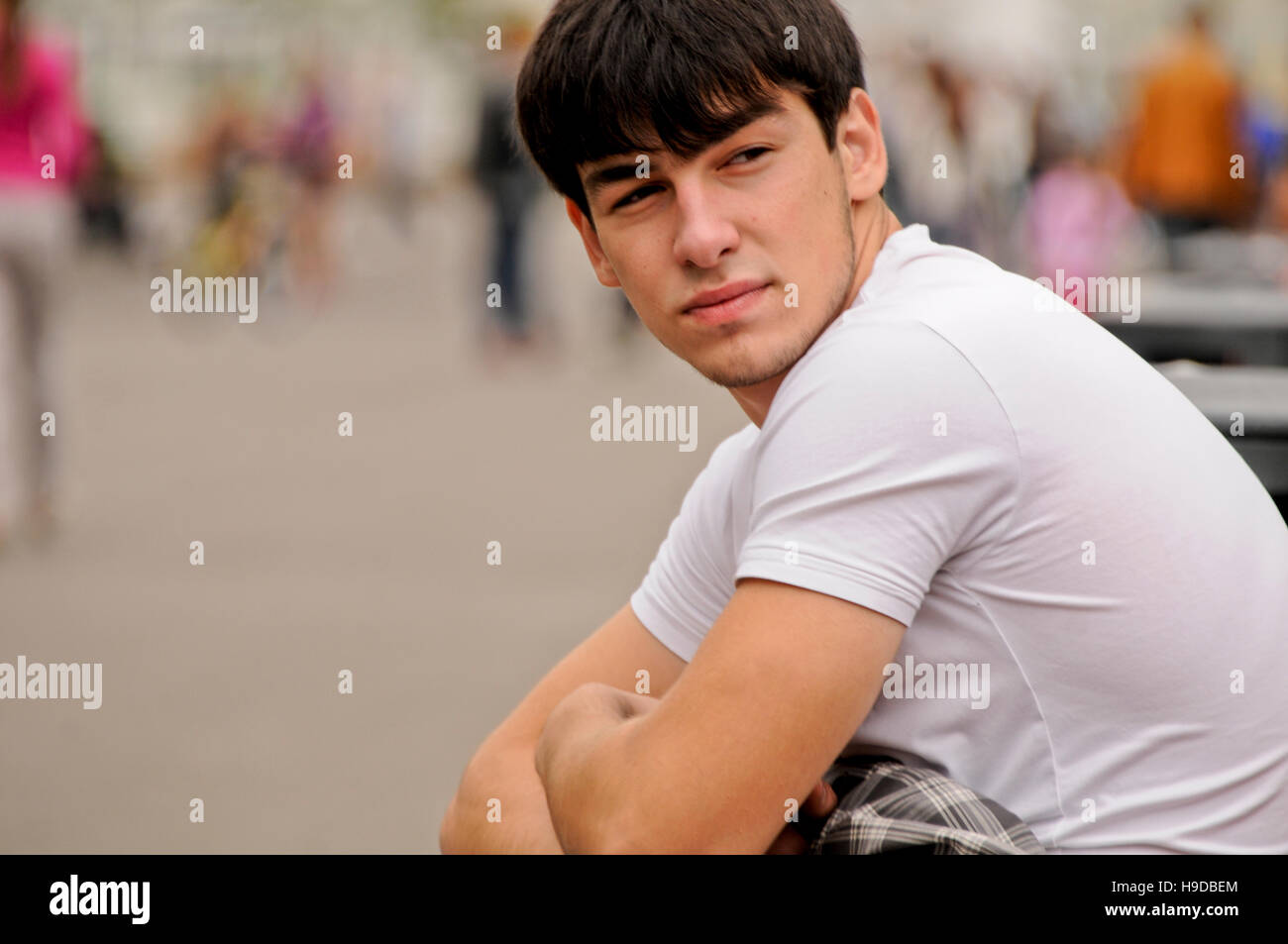 Portrait of a dark haired young Russian man, Gorky Park, Moscow, Russia Stock Photo