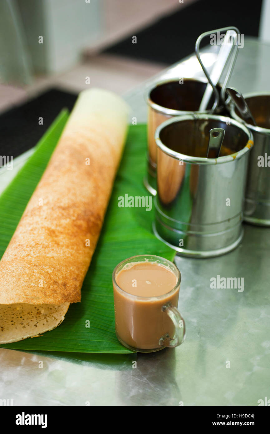 A paper dosa, a traditional fermented rice and black gram pancake native to southern India, in a restaurant in Penang, Malaysia. Stock Photo
