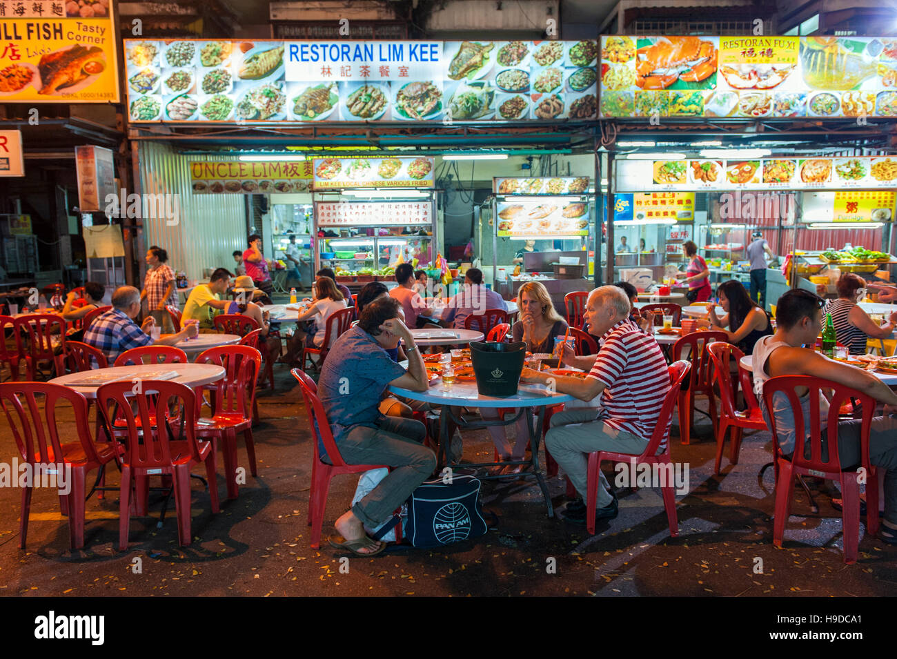 The street food night market on Jalan Alor in central Kuala Lumpur, where stalls offer everything from satay to grilled fish for a few dollars a plate Stock Photo