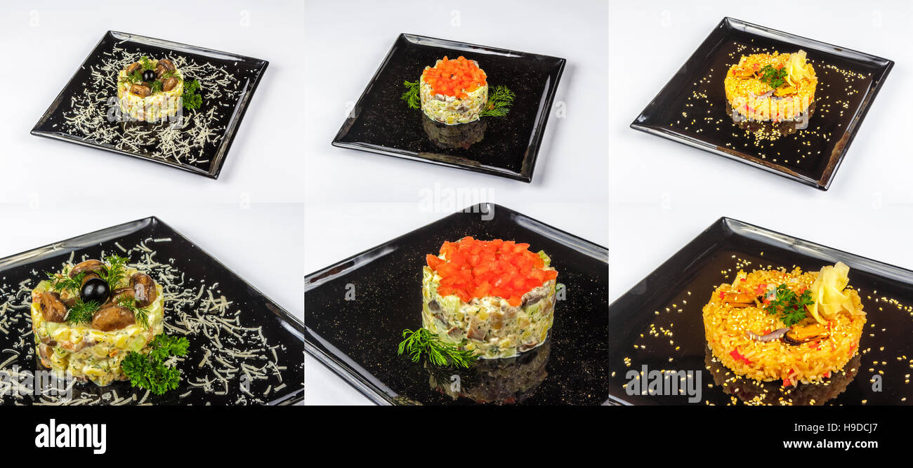 three salads with meat, tomatoes mushrooms and rise on black plate for celebration table Stock Photo