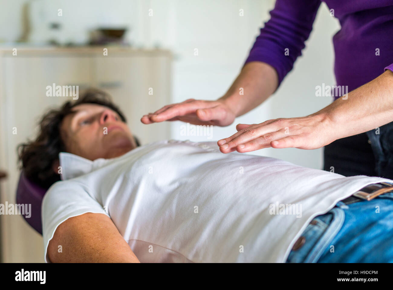 Therapeutic magnetism, healing session. Stock Photo