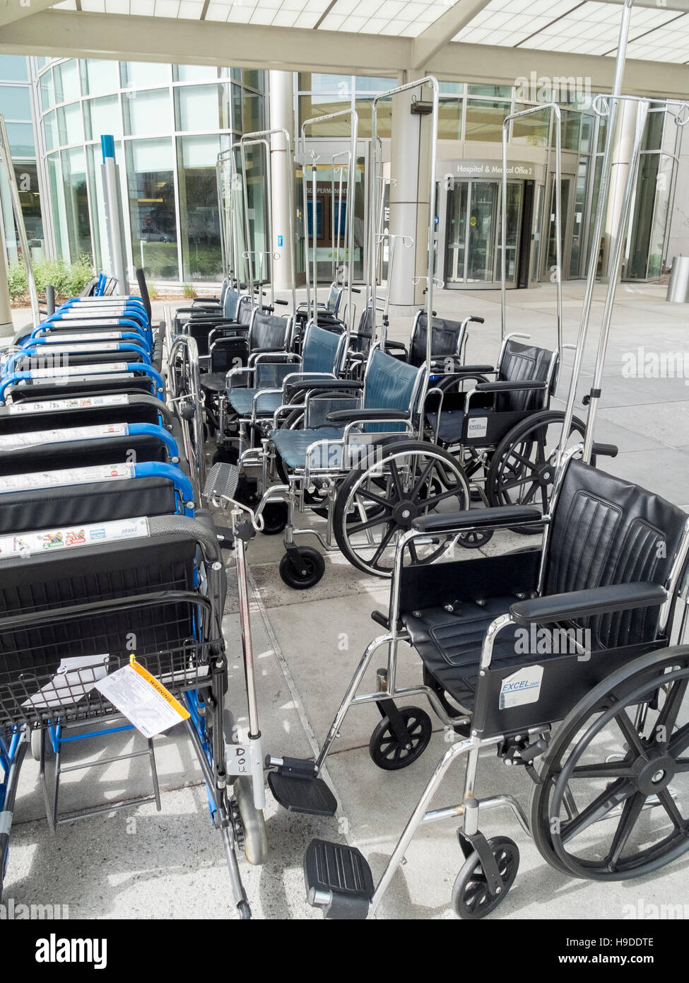 An organized group of wheelchairs is available for patients at a health