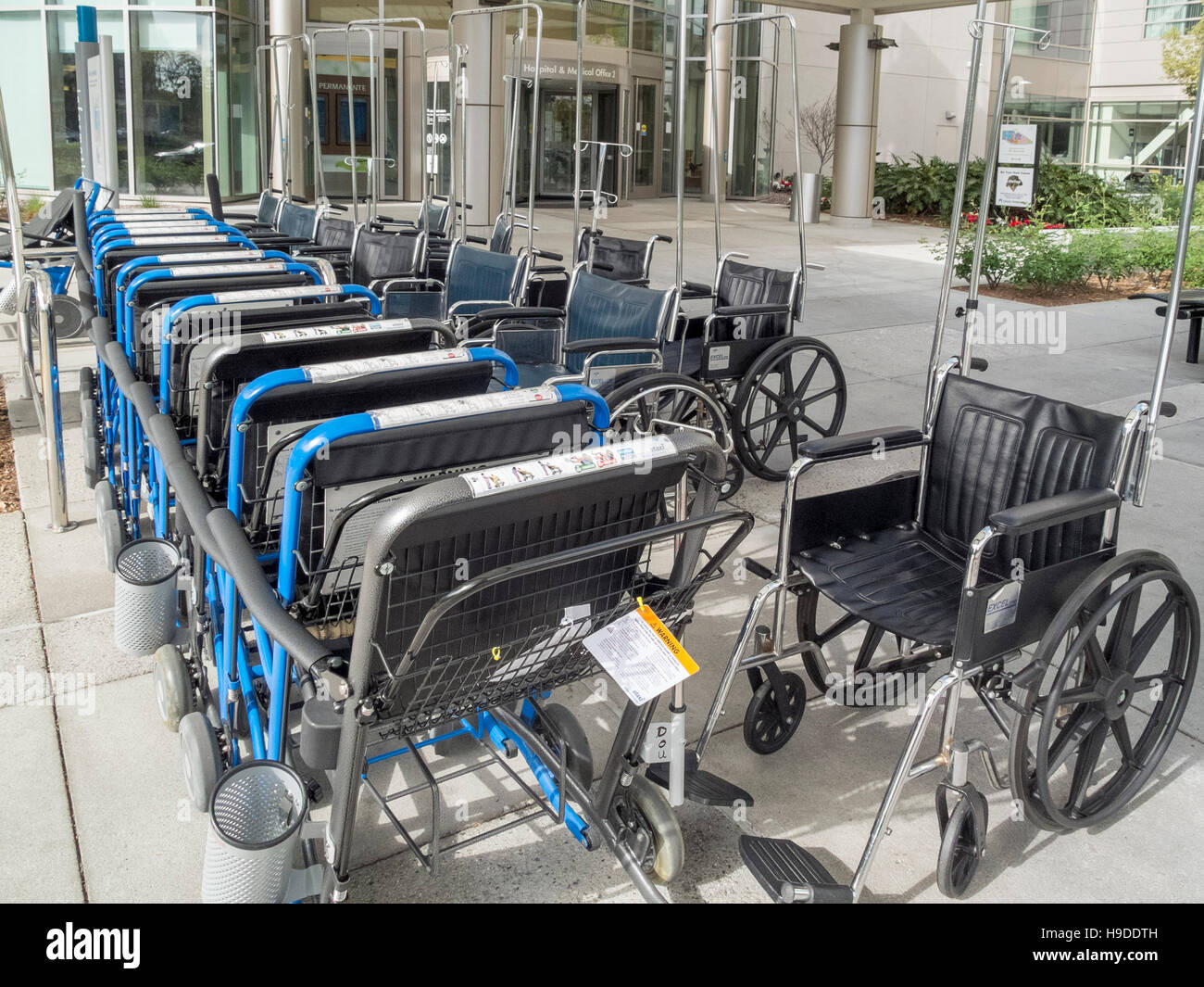 An organized group of wheelchairs is available for patients at a health